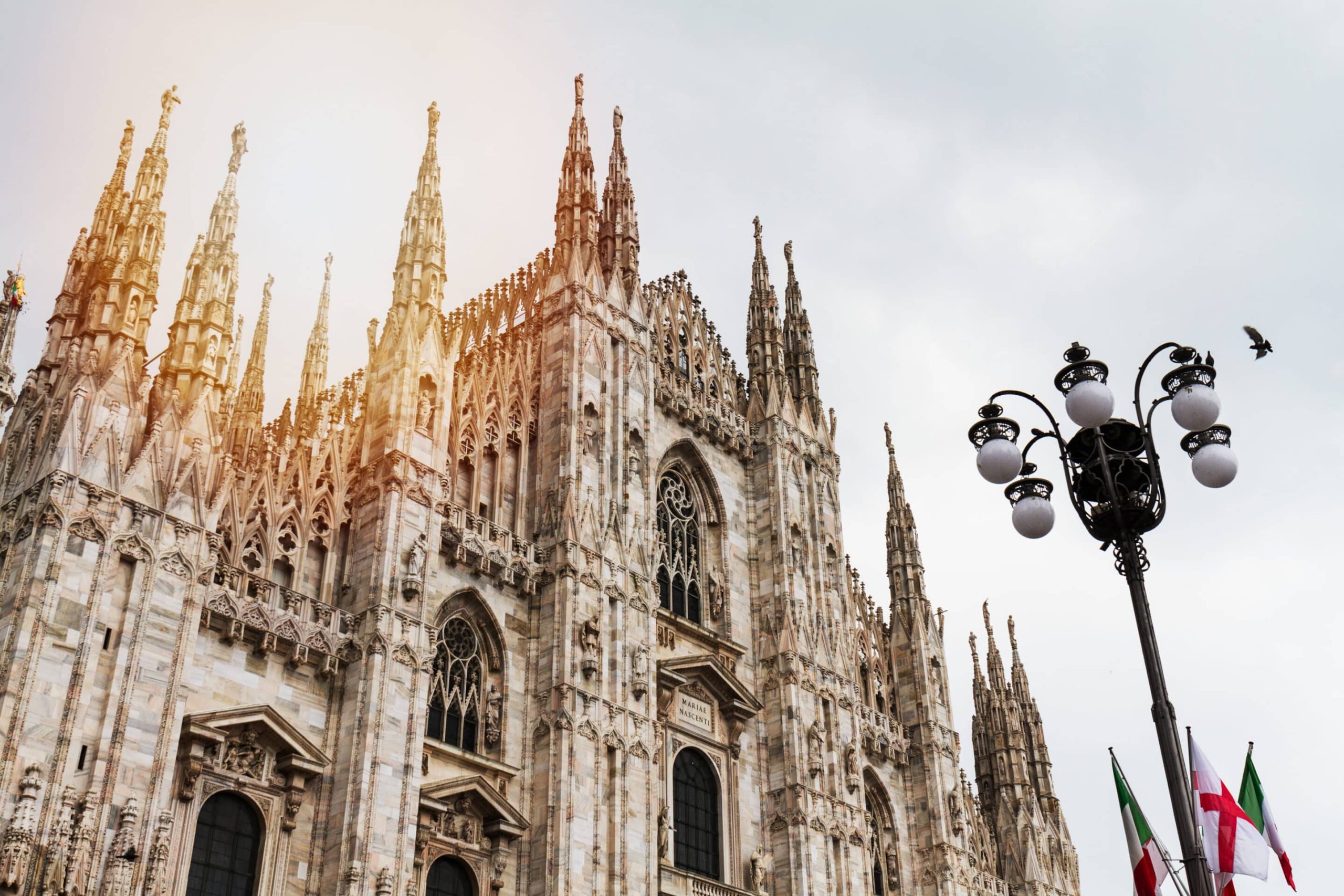 Beautiful Panoramic view of Duomo square in Milan with big stree